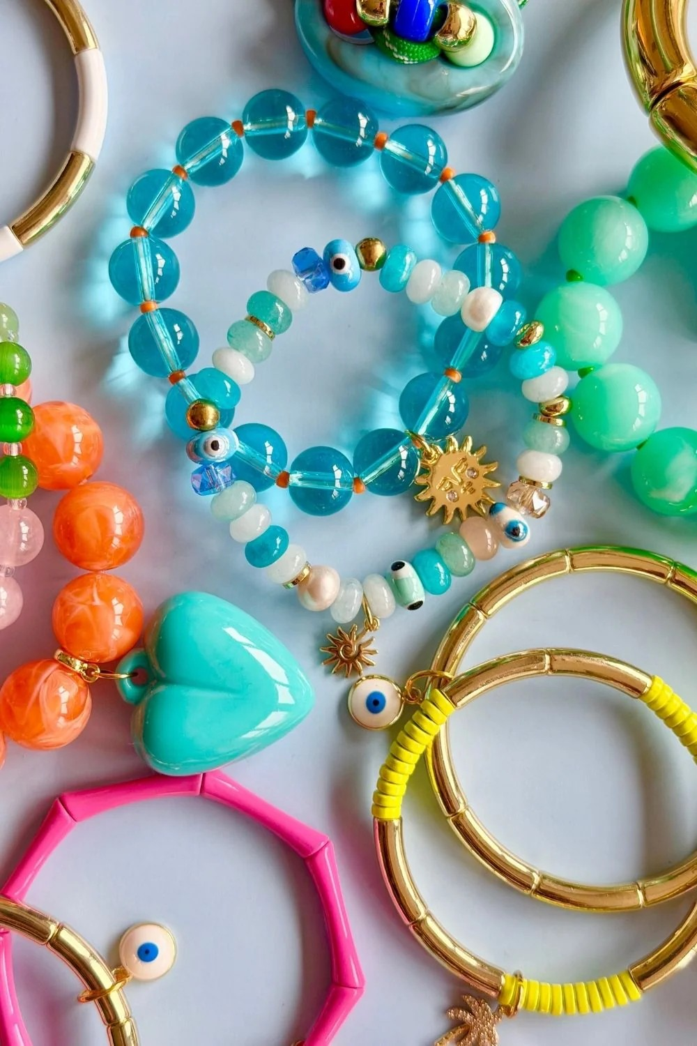 blue beaded bracelet with gold sun charm